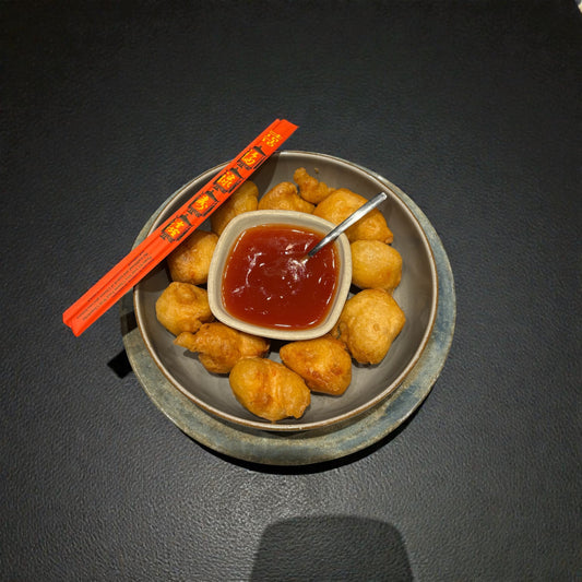 32. Gepaneerde kippenballetjes in zoetzure saus